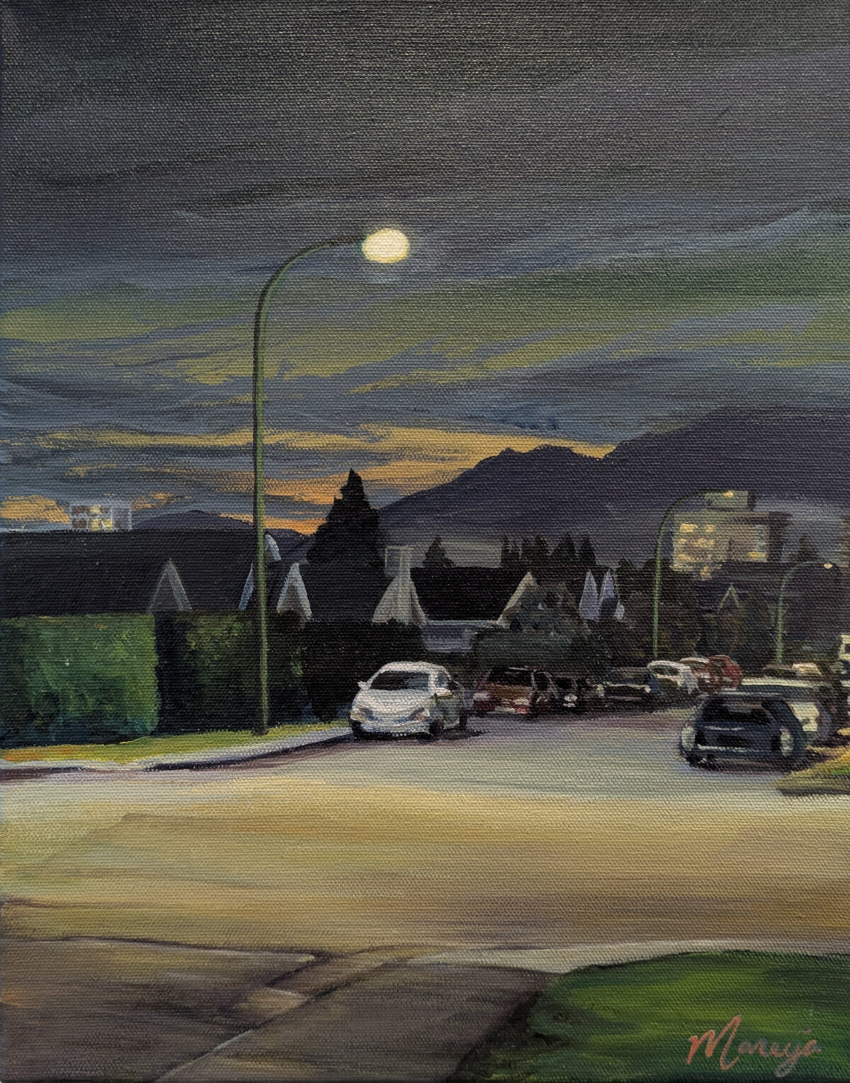 The sun sets on a suburban street in North Vancouver and the sky is cast in a glowing green light